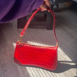 red hand bag or shoulder bag